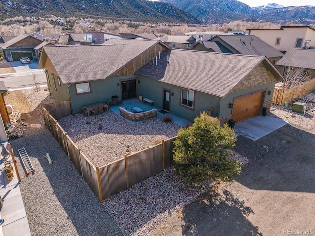 drone / aerial view with a residential view and a mountain view