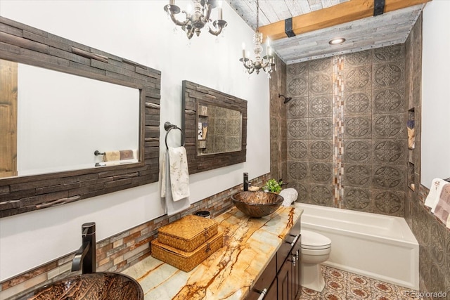 full bath with toilet, an inviting chandelier, bathing tub / shower combination, and vanity