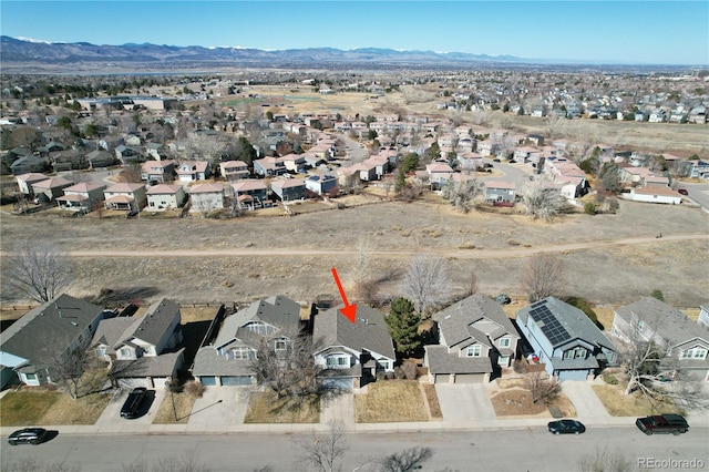 birds eye view of property featuring a residential view and a mountain view