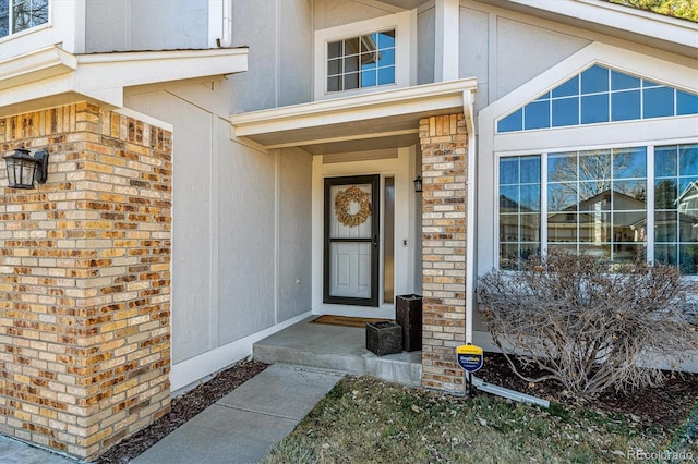 entrance to property with brick siding