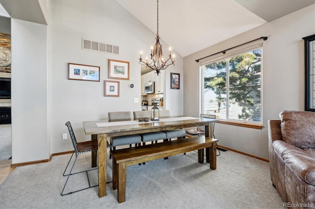 dining room featuring visible vents, baseboards, and light colored carpet