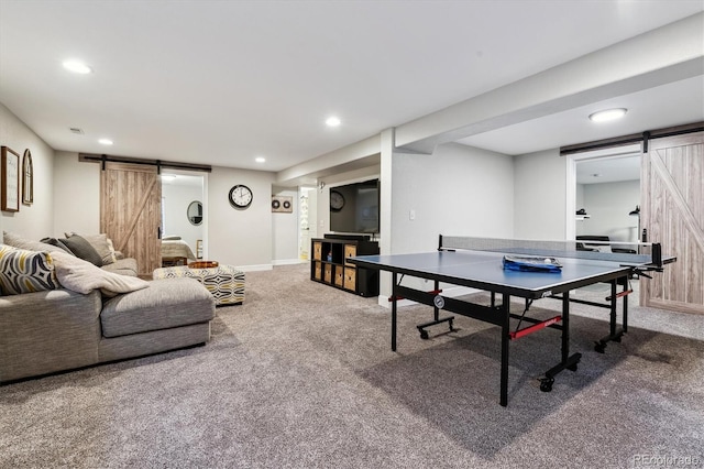 rec room featuring carpet flooring, recessed lighting, and a barn door