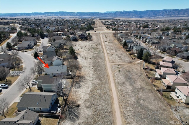 drone / aerial view featuring a mountain view and a residential view