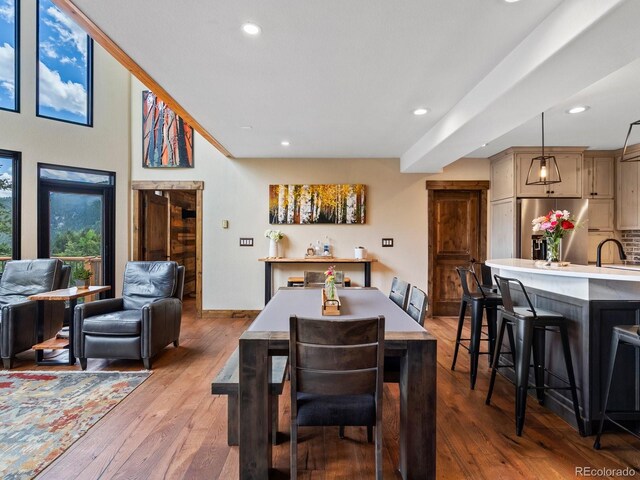 1194 Snyder Mountain Rd, Evergreen, CO 80439 - dining area featuring recessed lighting and hardwood / wood-style flooring