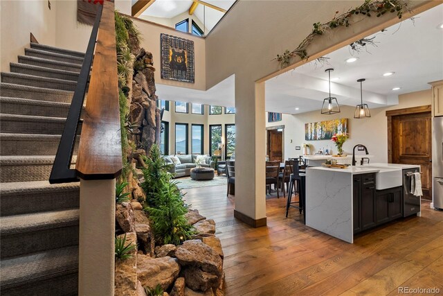1194 Snyder Mountain Rd, Evergreen, CO 80439 - kitchen featuring stainless steel appliances, wood-type flooring, healthy amount of natural light, open floor plan, and recessed lighting