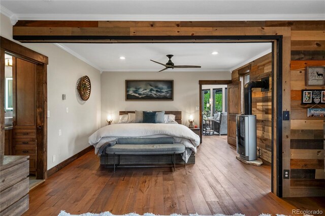 1194 Snyder Mountain Rd, Evergreen, CO 80439 - bedroom with hardwood / wood-style floors, recessed lighting, crown molding, and beam ceiling