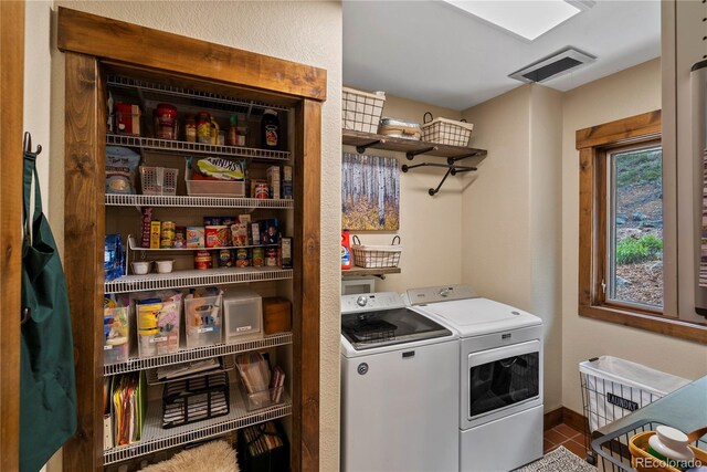 1194 Snyder Mountain Rd, Evergreen, CO 80439 - laundry area with washer and dryer and baseboards