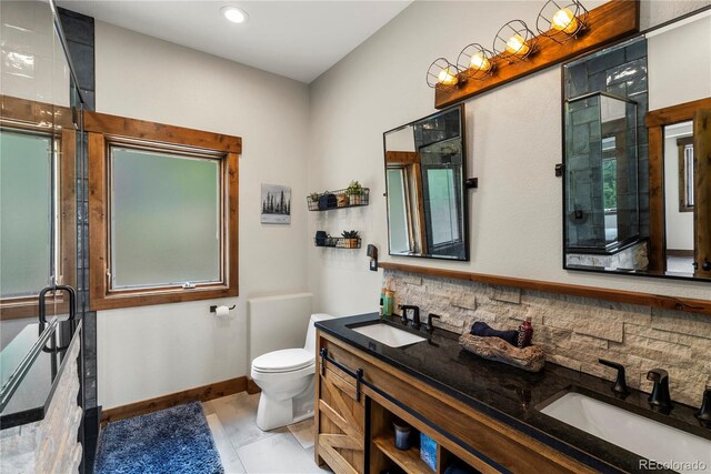 1194 Snyder Mountain Rd, Evergreen, CO 80439 - full bath featuring double vanity, a stall shower, recessed lighting, and tasteful backsplash