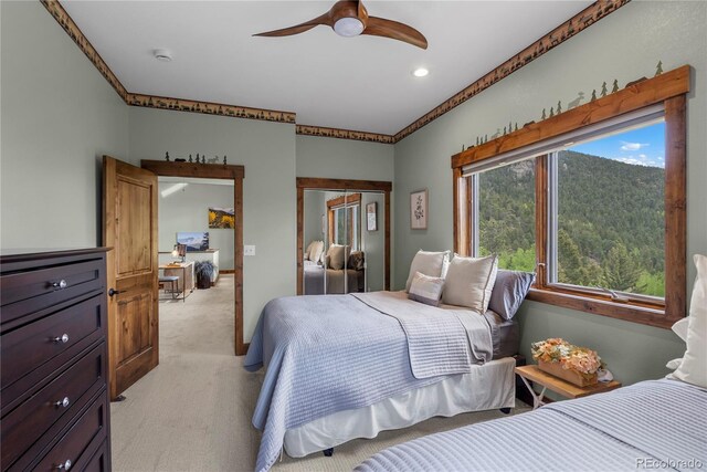 1194 Snyder Mountain Rd, Evergreen, CO 80439 - bedroom with light colored carpet, a closet, recessed lighting, and a ceiling fan