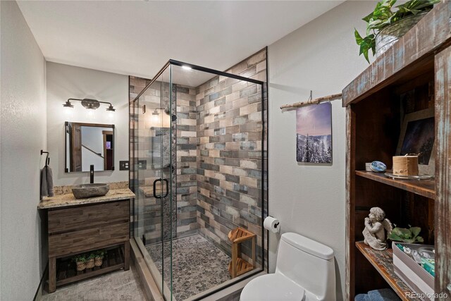 1194 Snyder Mountain Rd, Evergreen, CO 80439 - full bathroom with vanity and a shower stall