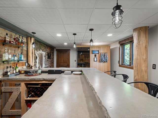 1194 Snyder Mountain Rd, Evergreen, CO 80439 - indoor bar with decorative light fixtures, recessed lighting, and a drop ceiling