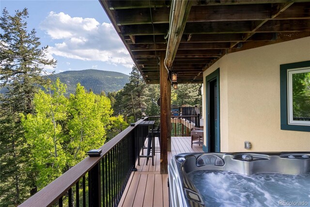 1194 Snyder Mountain Rd, Evergreen, CO 80439 - wooden terrace with a mountain view and a hot tub