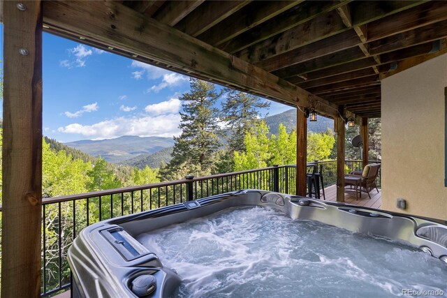 1194 Snyder Mountain Rd, Evergreen, CO 80439 - deck with a mountain view and a hot tub