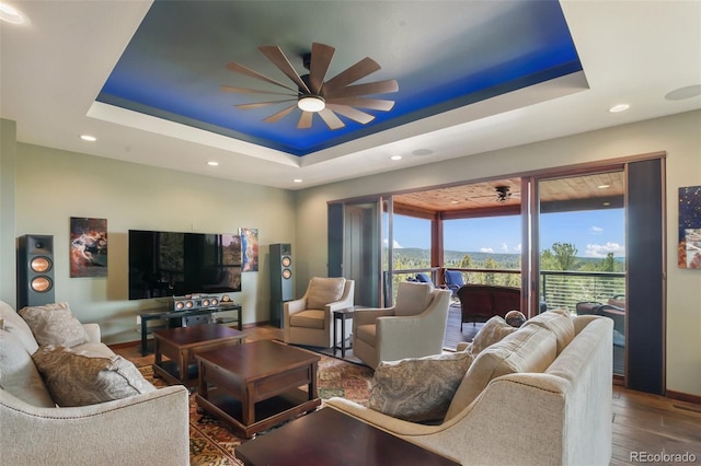 2754 County Rd 421, Florissant, CO 80816 - living area featuring a ceiling fan, a raised ceiling, wood finished floors, baseboards, and recessed lighting