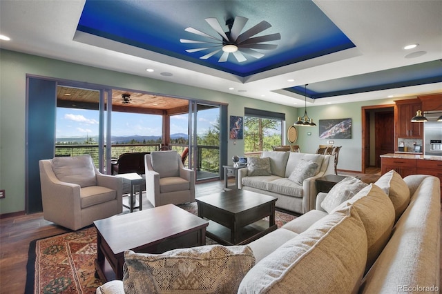 2754 County Rd 421, Florissant, CO 80816 - living area with a tray ceiling, a ceiling fan, wood finished floors, recessed lighting, and baseboards