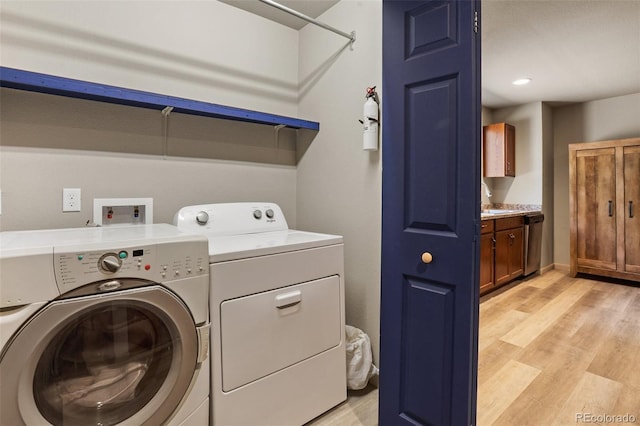 2754 County Rd 421, Florissant, CO 80816 - laundry room featuring washing machine and dryer and light wood finished floors