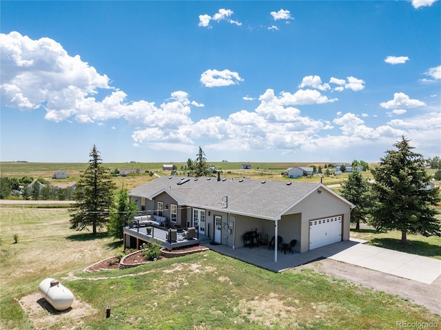 8804 Lariat Loop, Elizabeth, CO 80107 - view of front facade featuring driveway, a front yard, an attached garage, a deck, and an outdoor living space