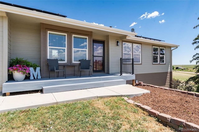 8804 Lariat Loop, Elizabeth, CO 80107 - property entrance with roof mounted solar panels