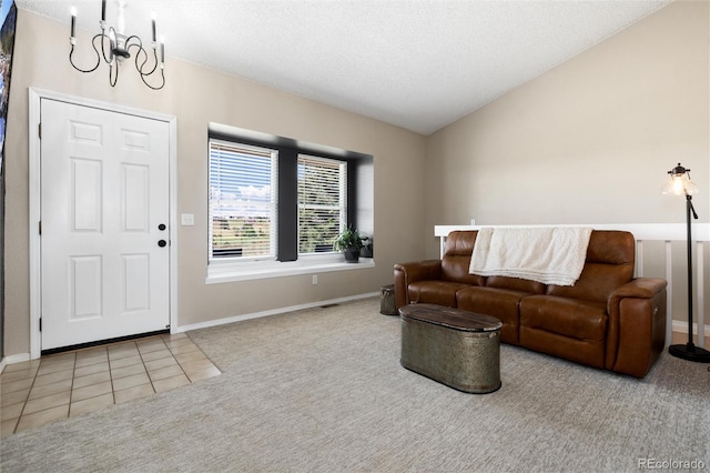 8804 Lariat Loop, Elizabeth, CO 80107 - carpeted living area featuring a chandelier, vaulted ceiling, a textured ceiling, and tile patterned flooring