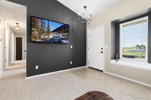 8804 Lariat Loop, Elizabeth, CO 80107 - entryway with carpet flooring and a chandelier
