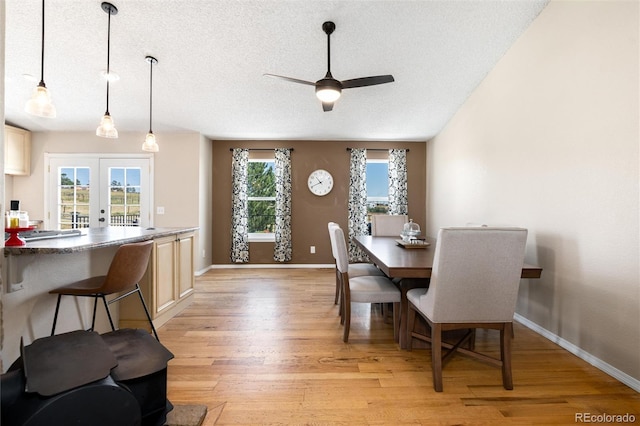 8804 Lariat Loop, Elizabeth, CO 80107 - dining space with light wood-type flooring, a textured ceiling, and ceiling fan