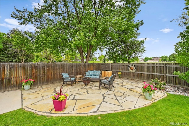 8896 W Prentice Ave, Littleton, CO 80123 - fenced backyard with an outdoor hangout area and a patio