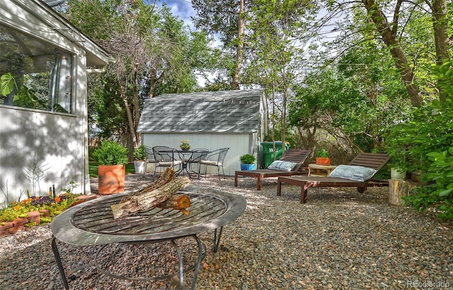 view of patio with an outbuilding