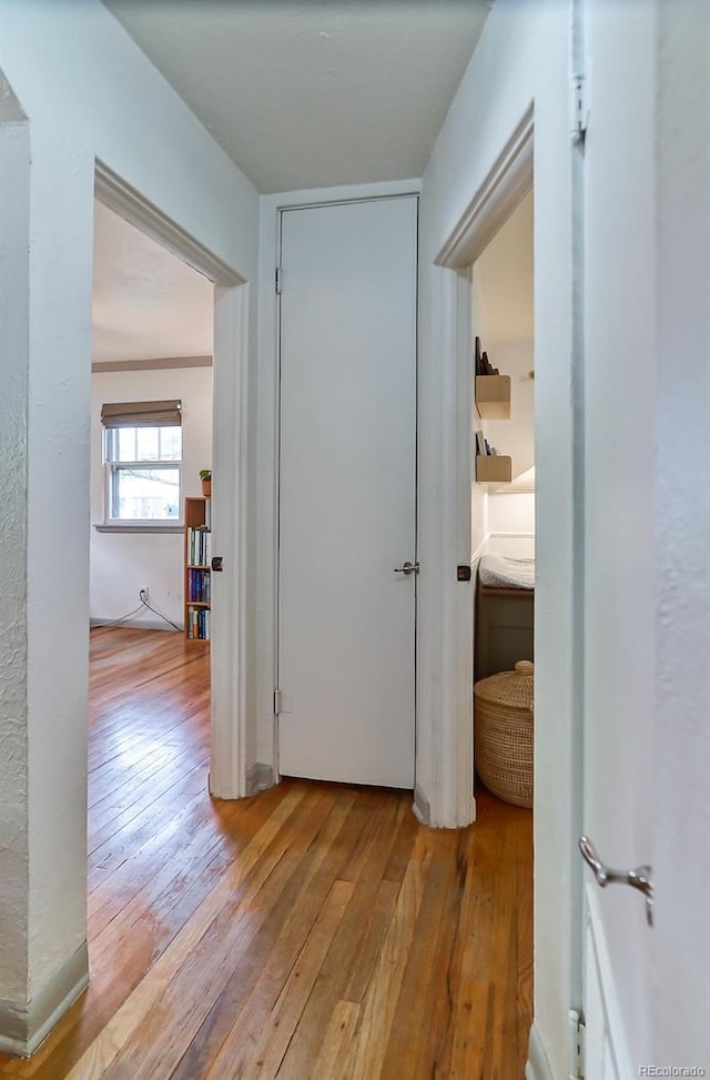 hallway featuring hardwood / wood-style flooring
