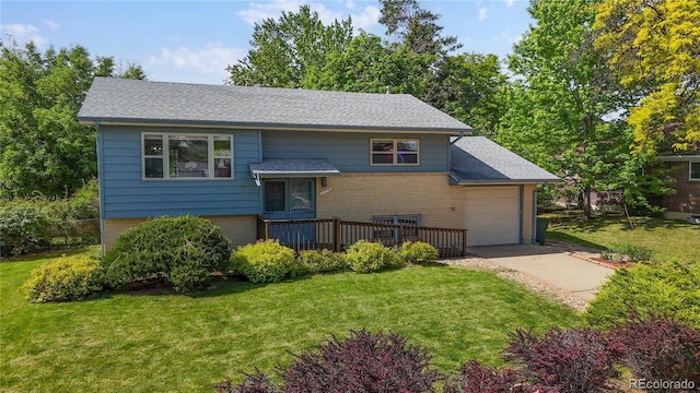11718 Keough Dr, Northglenn, CO 80233 - raised ranch with brick siding, a garage, concrete driveway, and a front lawn