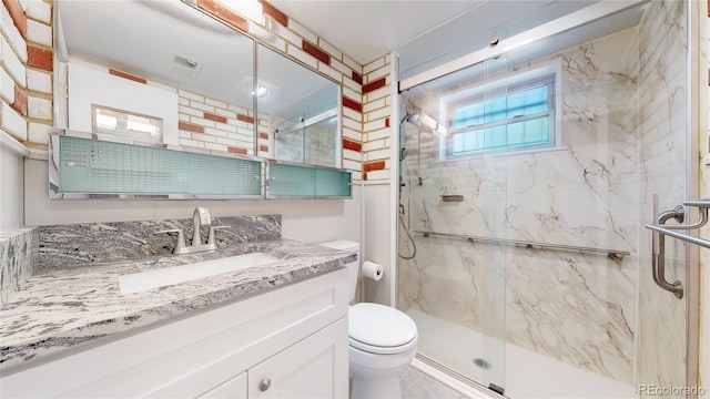 11718 Keough Dr, Northglenn, CO 80233 - bathroom featuring vanity and a marble finish shower