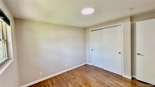 11718 Keough Dr, Northglenn, CO 80233 - unfurnished bedroom featuring wood finished floors and a closet