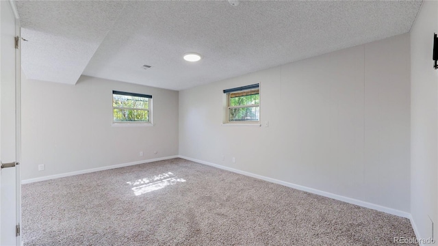 11718 Keough Dr, Northglenn, CO 80233 - carpeted empty room with a textured ceiling