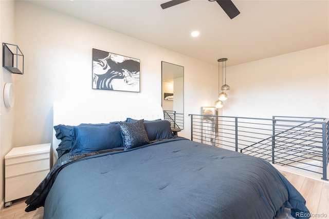 bedroom with recessed lighting, wood finished floors, and a ceiling fan