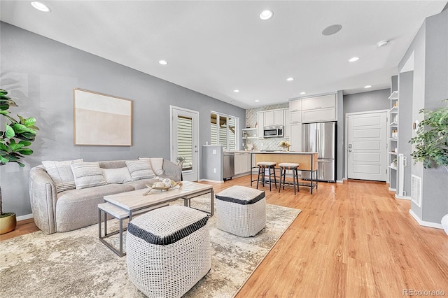 1903 W 66th Ave, Denver, CO 80221 - living area with light wood-style flooring and recessed lighting