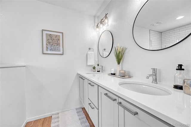 1903 W 66th Ave, Denver, CO 80221 - full bathroom featuring double vanity and baseboards