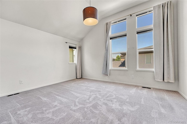1903 W 66th Ave, Denver, CO 80221 - spare room with carpet, healthy amount of natural light, and vaulted ceiling