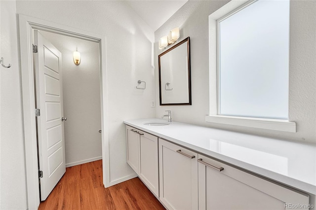 1903 W 66th Ave, Denver, CO 80221 - bathroom with wood finished floors and vanity