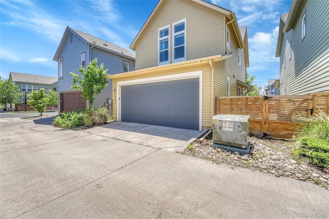 1903 W 66th Ave, Denver, CO 80221 - traditional-style house with a garage and concrete driveway