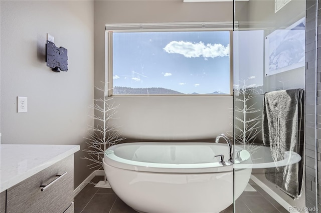 28424 Tepees Way, Evergreen, CO 80439 - full bath with tile patterned floors and a garden tub