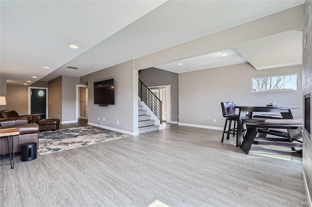 28424 Tepees Way, Evergreen, CO 80439 - living area with stairway, wood finished floors, and recessed lighting