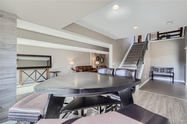 28424 Tepees Way, Evergreen, CO 80439 - dining room featuring stairway, wood finished floors, and recessed lighting