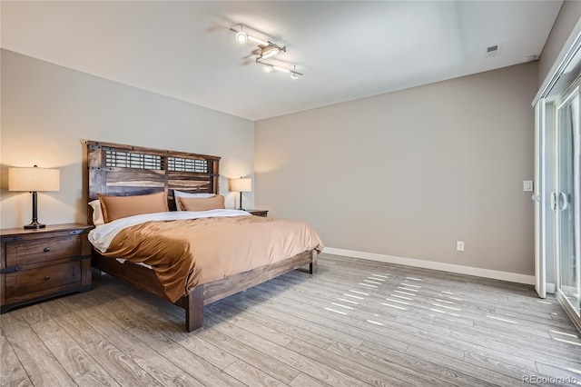 28424 Tepees Way, Evergreen, CO 80439 - bedroom featuring light wood-type flooring and baseboards
