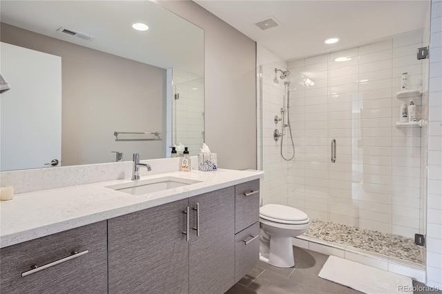 28424 Tepees Way, Evergreen, CO 80439 - bathroom featuring a shower stall, vanity, tile patterned floors, and recessed lighting