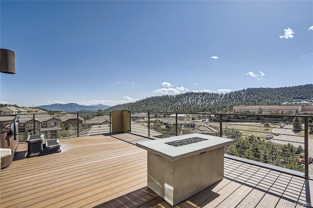 28424 Tepees Way, Evergreen, CO 80439 - wooden terrace featuring a mountain view and grilling area