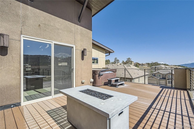 28424 Tepees Way, Evergreen, CO 80439 - wooden deck with a hot tub and a fire pit
