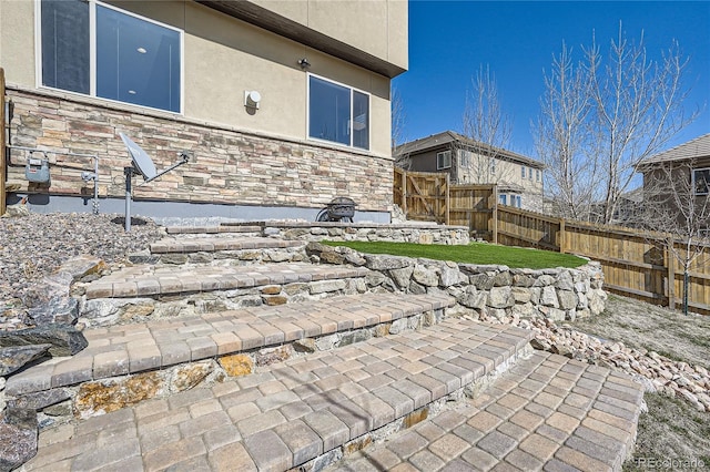28424 Tepees Way, Evergreen, CO 80439 - fenced backyard featuring a patio area