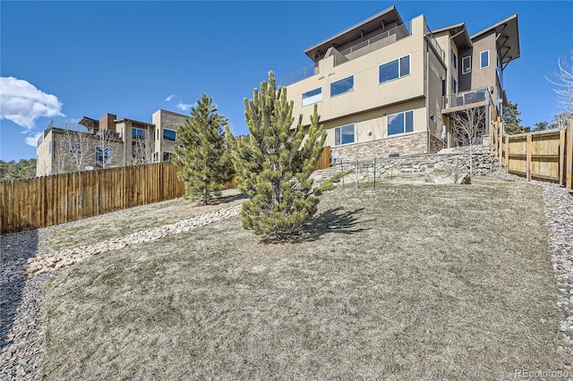 28424 Tepees Way, Evergreen, CO 80439 - back of property featuring stucco siding and stone siding