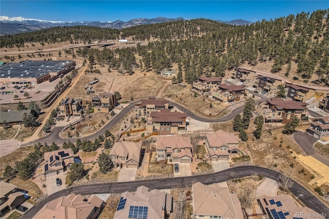 28424 Tepees Way, Evergreen, CO 80439 - aerial view of property's location featuring a mountainous background and nearby suburban area