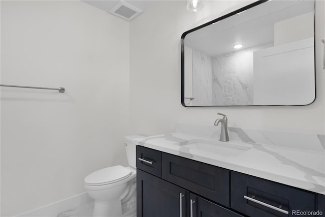 bathroom with toilet, vanity, visible vents, baseboards, and marble finish floor