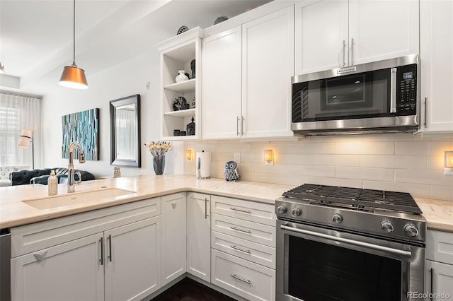 4150 Longview Ln, Boulder, CO 80301 - kitchen featuring appliances with stainless steel finishes, a sink, white cabinets, and decorative backsplash